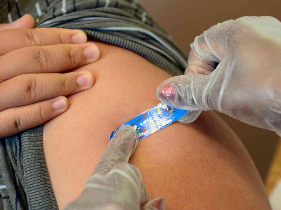 A student gets vaccinated against pertussis at a Los Angeles middle school in 2012. The state required that students be immunized to halt an epidemic of whooping cough. A student gets vaccinated against pertussis at a Los Angeles middle school in 2012. The state required that students be immunized to halt an epidemic of whooping cough.