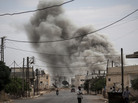 Smoke rises after an airstrike hit a Syrian village on Sept. 22. Smoke rises after an airstrike hit a Syrian village on Sept. 22.