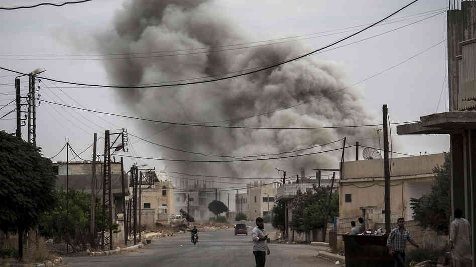 Smoke rises after an airstrike hit a Syrian village on Sept. 22. Smoke rises after an airstrike hit a Syrian village on Sept. 22.
