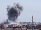 Smoke from heavy shelling rises above buildings in Dara'a, Syria, on Aug. 28. Smoke from heavy shelling rises above buildings in Dara'a, Syria, on Aug. 28.