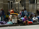 Homeless people rest on a public sidewalk early this year in downtown skid row area of Los Angeles. The United Way of Greater Los Angeles is attempting to end "chronic homelessness" by 2016 with a model that identifies the neediest cases and provides them with permanent homes. Homeless people rest on a public sidewalk early this year in downtown skid row area of Los Angeles. The United Way of Greater Los Angeles is attempting to end "chronic homelessness" by 2016 with a model that identifies the neediest cases and provides them with permanent homes.