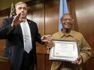 Glen James holds a special citation while facing reporters with Boston Police Commissioner Edward Davis during a news conference at police headquarters on Sept. 16. Glen James holds a special citation while facing reporters with Boston Police Commissioner Edward Davis during a news conference at police headquarters on Sept. 16.