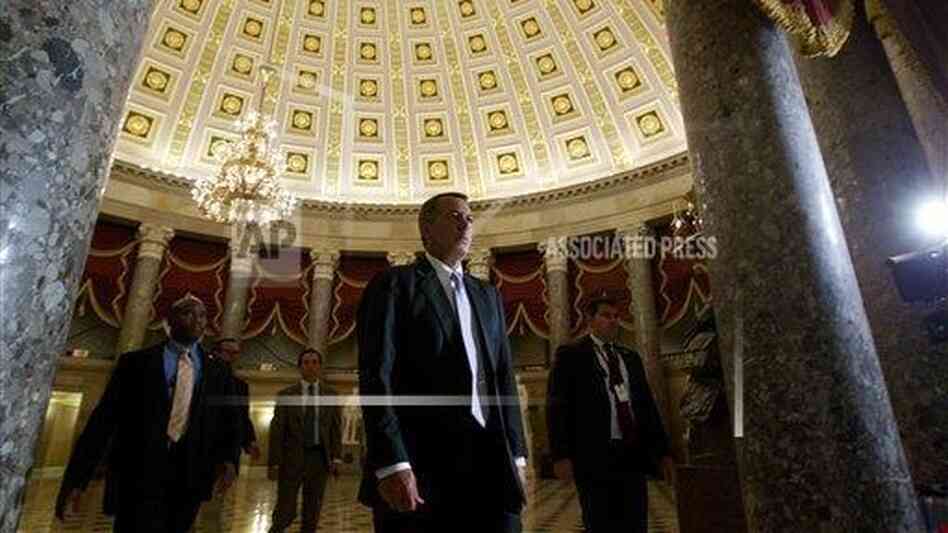 House Speaker John Boehner walks to the House floor on Saturday. House Speaker John Boehner walks to the House floor on Saturday.