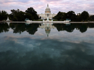 The Capitol is mirrored in its reflecting pool early Tuesday, as the partial federal shutdown began. But there's a battle still to come in which the stakes are even higher. The Capitol is mirrored in its reflecting pool early Tuesday, as the partial federal shutdown began. But there's a battle still to come in which the stakes are even higher.