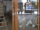 Bullet holes in the glass door of a shop in the Westgate Mall in Nairobi, Kenya. Bullet holes in the glass door of a shop in the Westgate Mall in Nairobi, Kenya.
