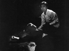 Rigid, semiconscious, his face an ashen mask, Kennedy lies in a pool of his own blood on the concrete floor, a bullet deep in his brain and another in his neck. Juan Romero, a busboy whose hand Kennedy had shaken before the shots, tried to comfort him. Rigid, semiconscious, his face an ashen mask, Kennedy lies in a pool of his own blood on the concrete floor, a bullet deep in his brain and another in his neck. Juan Romero, a busboy whose hand Kennedy had shaken before the shots, tried to comfort him.