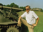 Tom Clancy poses next to a tank in his Maryland backyard. Though he never served in the military, his books were renowned for their detail. Tom Clancy poses next to a tank in his Maryland backyard. Though he never served in the military, his books were renowned for their detail.