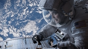 The astronauts (Bullock and George Clooney) were repairing the Hubble Telescope before their shuttle was hit with debris.