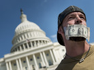 John Zangas, a furloughed federal worker, protests the government shutdown outside the U.S. Capitol on Wednesday. John Zangas, a furloughed federal worker, protests the government shutdown outside the U.S. Capitol on Wednesday.