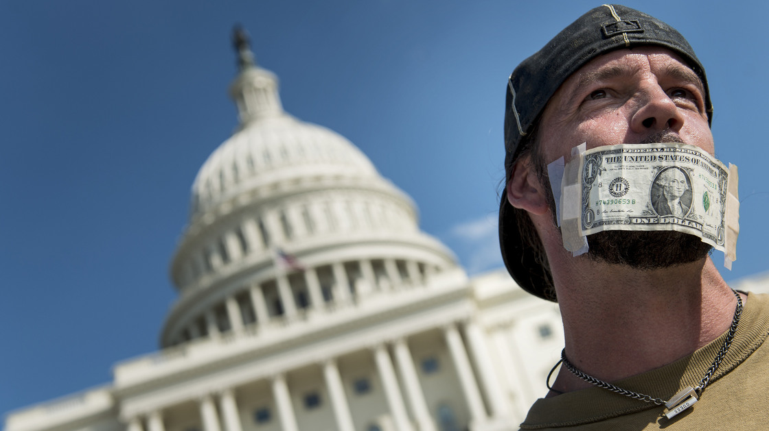 John Zangas, a furloughed federal worker, protests the government shutdown outside the U.S. Capitol on Wednesday.