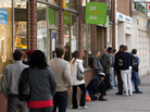 Job seekers line up outside a work support office in London in 2009. New measures proposed by the Conservative-led government will require recipients of unemployment benefits to do unpaid community work, spend workdays at a job center or participate in intensive programs to help solve personal issues that prevent them from working. Job seekers line up outside a work support office in London in 2009. New measures proposed by the Conservative-led government will require recipients of unemployment benefits to do unpaid community work, spend workdays at a job center or participate in intensive programs to help solve personal issues that prevent them from working.