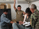 Afghan medics at Forward Operating Base Nolay in the southern province of Helmand treat an Afghan police officer shot by militants. Afghan medics at Forward Operating Base Nolay in the southern province of Helmand treat an Afghan police officer shot by militants.