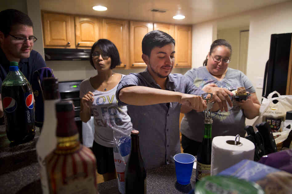 Younes celebrates his birthday with Martinez (second from left) and several of their friends at their apartment on a Saturday night.