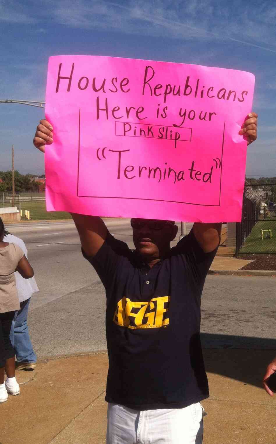 Furloughed from his job with the Agriculture Department, Tyrone Van Hoesen joins fellow members of the American Federation of Government Employees protesting at the Federal Center in St. Louis. Furloughed from his job with the Agriculture Department, Tyrone Van Hoesen joins fellow members of the American Federation of Government Employees protesting at the Federal Center in St. Louis.