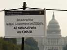 The U.S. Capitol looms in the background as a sign on the National Mall reminds visitors that national parks are closed because of the partial federal government shutdown. The U.S. Capitol looms in the background as a sign on the National Mall reminds visitors that national parks are closed because of the partial federal government shutdown.