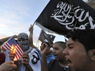 Libyan protesters burn a replica of the U.S. flag on Monday during a demonstration against the capture of Abu Anas al-Libi. U.S. forces seized him Saturday in the Libyan capital Tripoli. He is accused of involvement in two U.S. embassy bombings in Africa in 1998 and is being held on a U.S. Navy ship in the Mediterranean Sea. Libyan protesters burn a replica of the U.S. flag on Monday during a demonstration against the capture of Abu Anas al-Libi. U.S. forces seized him Saturday in the Libyan capital Tripoli. He is accused of involvement in two U.S. embassy bombings in Africa in 1998 and is being held on a U.S. Navy ship in the Mediterranean Sea.