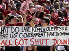 Alabama fans hold up a sign about the government shutdown during the first half of an NCAA college football game against Georgia State on Saturday. Alabama fans hold up a sign about the government shutdown during the first half of an NCAA college football game against Georgia State on Saturday.
