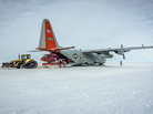 A helicopter is unloaded from an LC-130 in Antarctica last December. Researchers on this mission were studying the Pine Island Glacier, one of the fastest-receding glaciers on the continent. A helicopter is unloaded from an LC-130 in Antarctica last December. Researchers on this mission were studying the Pine Island Glacier, one of the fastest-receding glaciers on the continent.