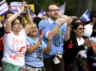 Protesters chant during the immigration reform rally in front of the U.S. Capitol on Tuesday. Capitol Police arrested 200 demonstrators after they sat down and blocked a street. Protesters chant during the immigration reform rally in front of the U.S. Capitol on Tuesday. Capitol Police arrested 200 demonstrators after they sat down and blocked a street.