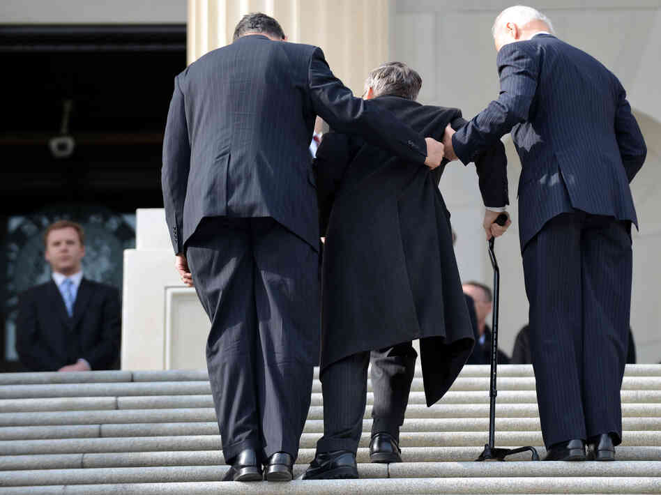 Sen. Mark Kirk, R-Ill., gets help entering the Capitol from Vice President Joe Biden (right) in January 2013, one year after suffering a stroke at age 52. Sen. Mark Kirk, R-Ill., gets help entering the Capitol from Vice President Joe Biden (right) in January 2013, one year after suffering a stroke at age 52.