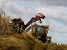 Mechanical harvesters cut sugar cane on U.S. Sugar Corp. land in Clewiston, Fla., in 2008, the same year the state struck a deal to buy most of the company's Everglades holdings. Mechanical harvesters cut sugar cane on U.S. Sugar Corp. land in Clewiston, Fla., in 2008, the same year the state struck a deal to buy most of the company's Everglades holdings.