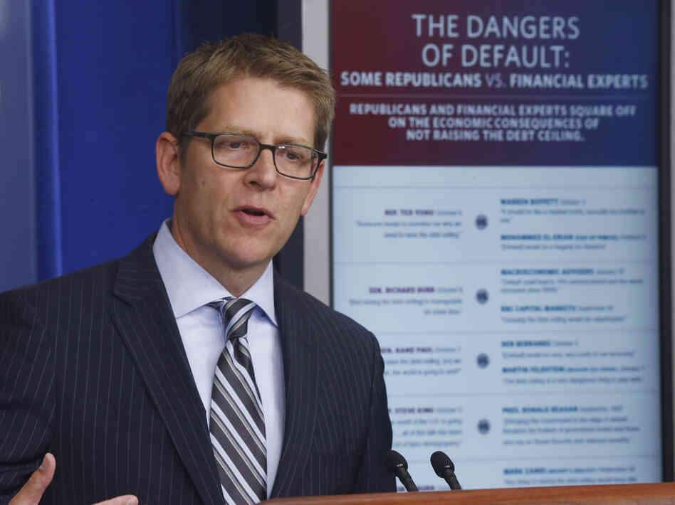 White House press secretary Jay Carney uses a visual aid comparing what Republican lawmakers said against what financial leaders said as he briefs reporters at the White House Thursday. White House press secretary Jay Carney uses a visual aid comparing what Republican lawmakers said against what financial leaders said as he briefs reporters at the White House Thursday.