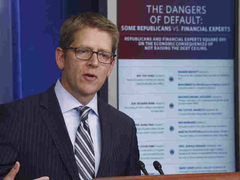 White House press secretary Jay Carney uses a visual aid comparing what Republican lawmakers said against what financial leaders said as he briefs reporters at the White House Thursday. White House press secretary Jay Carney uses a visual aid comparing what Republican lawmakers said against what financial leaders said as he briefs reporters at the White House Thursday.