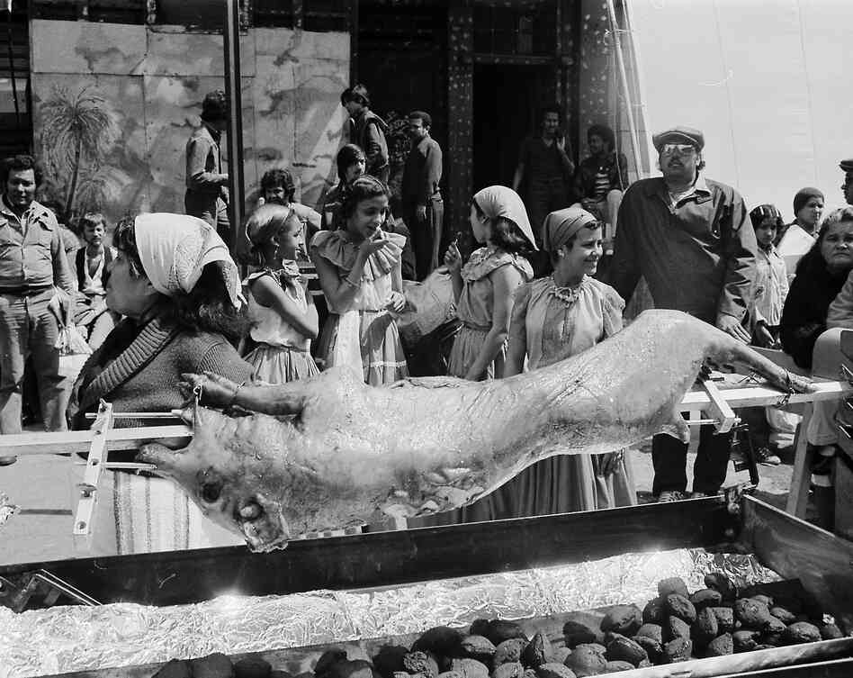 A staged pig roasting in Lower East Side, Manhattan, for the film Oliver's Story in 1978. A staged pig roasting in Lower East Side, Manhattan, for the film Oliver's Story in 1978.
