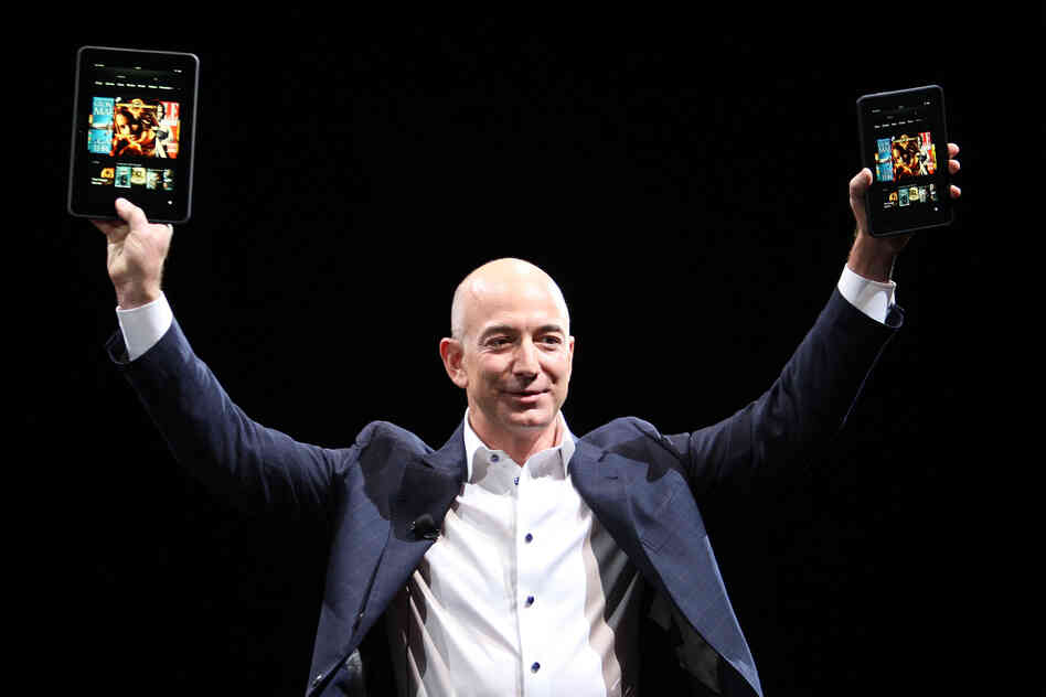 Amazon CEO Jeff Bezos holds up the Kindle Fire HD in two sizes during a press conference in Santa Monica, Calif., in September 2012. Amazon CEO Jeff Bezos holds up the Kindle Fire HD in two sizes during a press conference in Santa Monica, Calif., in September 2012.