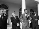 President John F. Kennedy enjoys a moment of levity at this Rose Garden ceremony marking Columbus Day, 1963. President John F. Kennedy enjoys a moment of levity at this Rose Garden ceremony marking Columbus Day, 1963.
