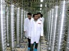 Former Iranian President Mahmoud Ahmadinejad inspects the Natanz nuclear plant in central Iran on March 8, 2007. The tall cylinders are centrifuges for enriching uranium. Former Iranian President Mahmoud Ahmadinejad inspects the Natanz nuclear plant in central Iran on March 8, 2007. The tall cylinders are centrifuges for enriching uranium.