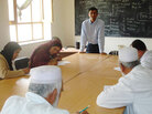 Dr. Dilip Joseph, standing, teaches medical personnel in Afghanistan. Dr. Dilip Joseph, standing, teaches medical personnel in Afghanistan.