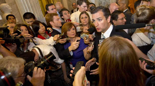 Reporters surround Sen. Ted Cruz after he finished his marathon speech. (AP)
