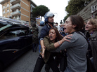 Anti-fascist demonstrators shout as the hearse carrying the coffin of Nazi war criminal Erich Priebke arrives in Albano Laziale, near Rome, on Tuesday. A Catholic splinter group planned to hold a funeral for Priebke, despite attempts by the local mayor to prevent it. Anti-fascist demonstrators shout as the hearse carrying the coffin of Nazi war criminal Erich Priebke arrives in Albano Laziale, near Rome, on Tuesday. A Catholic splinter group planned to hold a funeral for Priebke, despite attempts by the local mayor to prevent it.