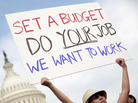 A furloughed federal worker protests outside the U.S. Capitol last week, demanding an end to the shutdown. A furloughed federal worker protests outside the U.S. Capitol last week, demanding an end to the shutdown.
