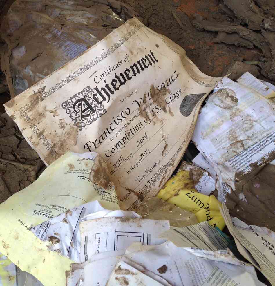 Inside one family's home, an English as a second language certificate remains untorn. Inside one family's home, an English as a second language certificate remains untorn.