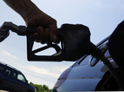 A motorist fuels up at a service station in Springfield, Ill. A motorist fuels up at a service station in Springfield, Ill.