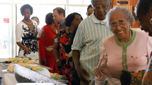 Gloria P. Brown, Class of 1951, wore her sorority colors to a homecoming event. The guest speaker, E. Ray Williams, a black World War II vet, credited the life he'd been able to live to the college.