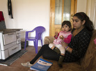 Leonarda Dibrani, 15, holds her sister, Medina, in Mitrovica, Kosovo, on Friday. Police seized Leonarda from a school field trip last week and expelled her and her family from France. The case has prompted protests across France. Leonarda Dibrani, 15, holds her sister, Medina, in Mitrovica, Kosovo, on Friday. Police seized Leonarda from a school field trip last week and expelled her and her family from France. The case has prompted protests across France.