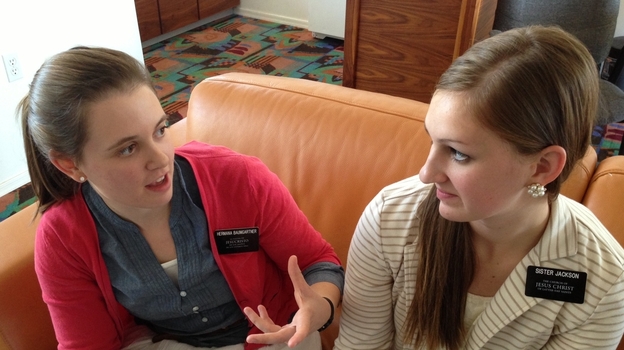 Alisa Baumgartner chats with fellow missionary Andrea Jackson. Jackson, 19, is taking 18 months off from college to do mission work. (Image credit: KJZZ)