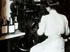 A woman places labels on Old Crow bourbon bottles sometime in the early 1900s. A woman places labels on Old Crow bourbon bottles sometime in the early 1900s.