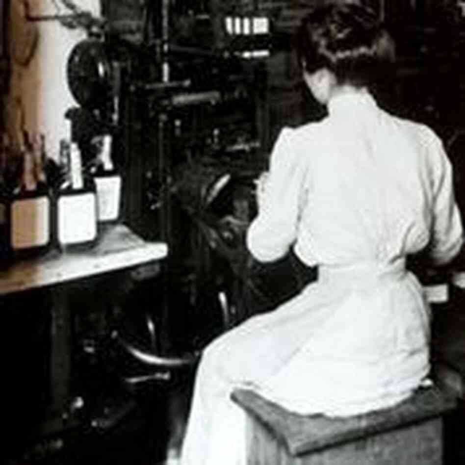 A woman places labels on Old Crow bourbon bottles sometime in the early 1900s. A woman places labels on Old Crow bourbon bottles sometime in the early 1900s.