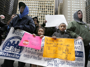 Members of the Chicago Teachers Union, parents, students and other opponents of a plan to close scores of Chicago public schools march through downtown Chicago in March. In the end, the city closed 50 schools, mostly in low-income communities.