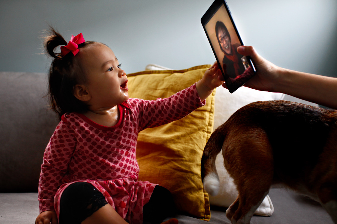 Eva Hu-Stiles virtually interacts with her grandmother. iPad assist by Elise Hu-Stiles.