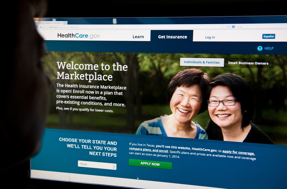 A woman looks at the HealthCare.gov insurance exchange internet site.