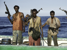 Barkhad Abdi (center) learned to swim, navigate small skiff boats, handle weapons — and act — for the film Captain Phillips. Barkhad Abdi (center) learned to swim, navigate small skiff boats, handle weapons — and act — for the film Captain Phillips.
