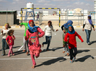 Children play at the Zaatari refugee camp in Jordan, where more than 120,000 Syrian refugees live. Roughly two-thirds are kids, many of whom have been traumatized by the violence in their homeland. Children play at the Zaatari refugee camp in Jordan, where more than 120,000 Syrian refugees live. Roughly two-thirds are kids, many of whom have been traumatized by the violence in their homeland.