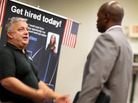 Hans Kahl (left) speaks with prospective employees at a job fair for veterans, in Miami on Tuesday. With job growth still slow, the Federal Reserve may keep trying to stimulate the economy. Hans Kahl (left) speaks with prospective employees at a job fair for veterans, in Miami on Tuesday. With job growth still slow, the Federal Reserve may keep trying to stimulate the economy.