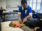 Stacy Riggs of Fairfax, Va., is prepped for a screening for atrial fibrillation by Life Line Screening medical assistant Kennea Blake at Messiah United Methodist Church in Springfield, Va. Stacy Riggs of Fairfax, Va., is prepped for a screening for atrial fibrillation by Life Line Screening medical assistant Kennea Blake at Messiah United Methodist Church in Springfield, Va.