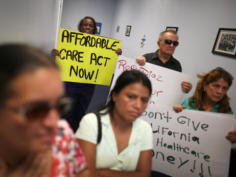 Protesters fill the Miami office of Florida state Rep. Manny Diaz Jr. on Sept. 20 to protest his stance against expansion of health coverage in the state. Protesters fill the Miami office of Florida state Rep. Manny Diaz Jr. on Sept. 20 to protest his stance against expansion of health coverage in the state.